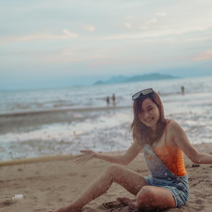 Lara Chen, Lead Design Curator at Note Bay Harbor, reviewing corporate floral arrangements